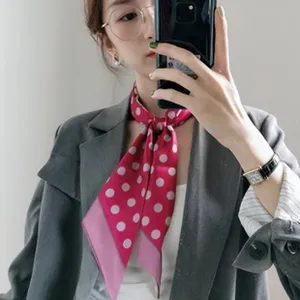 Pink polka dot silk scarf for women, elegant fashion neckerchief and hair accessory.