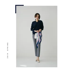 Elegant women's printed square silk scarf, stylish fashion accessory for autumn and winter outfits.