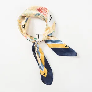 Detailed close-up view of the imitation silk square scarf featuring stylish playing card print.