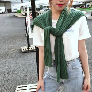 Green knitted scarf shawl for women, stylish ribbed winter warm wrap clothing accessory.