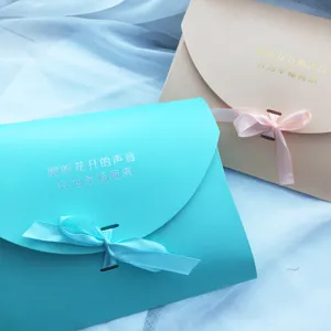 Elegant envelope gift boxes with ribbon bows, perfect for wedding returns and holidays.