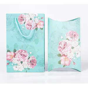 Mint green floral gift bag and pillow box set with elegant pink rose pattern details for weddings.