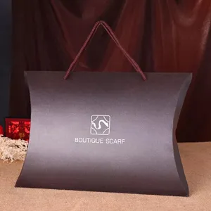Detailed view of silk scarf gift box, elegant brown pillow paper packaging bag for gifts.