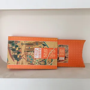 Silk Road themed orange gift box packaging for silk scarves, elegant design for wedding.