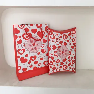 Red heart pattern paper gift bag and pillow box set for wedding return gifts packaging.