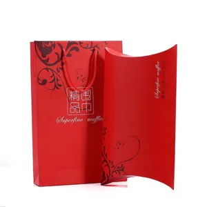 Red gift paper bag and pillow box packaging set for silk scarves and holiday presents.