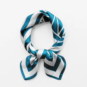 Blue and white geometric print silk scarf detail, elegant neckerchief texture closeup display.