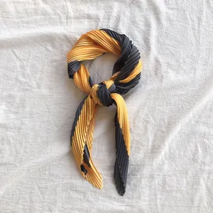 Pleated small silk scarf, elegant yellow and dark grey striped neckerchief, stylish accessory.