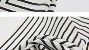 Nahaufnahme der glatten Seidenstofftextur mit klassischem schwarz-weissem Streifenmuster.