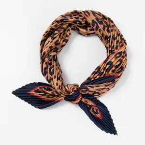 Detailed view of women's pleated fashion neck scarf with stylish print and soft texture.