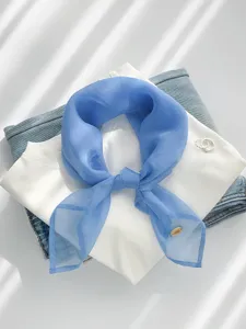 Detailed shot of blue sheer chiffon scarf, lightweight and breathable neckerchief accessory.