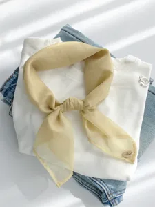 Light yellow solid color chiffon square scarf detail, elegant neckerchief for women.