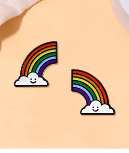 Detail view of cute smiling rainbow cloud enamel pins, alloy fashion accessories.