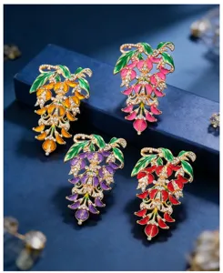 Vintage wisteria flower brooch enamel rhinestone multi-color clothing accessory detail.
