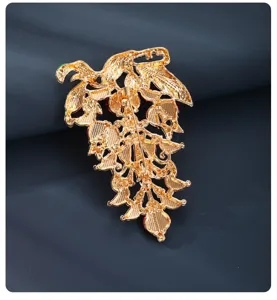 Detailed view of the back of the vintage gold tone grape brooch showing secure pin mechanism.
