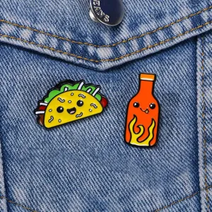 Cute taco and hot sauce enamel pins cartoon food alloy badge for jacket and backpack decor.