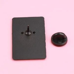 Close up of the black enamel pin back with secure rubber clutch and metal pin post detail.