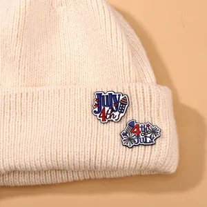 American Independence Day knitted beanie with festive enamel pins, fashion holiday accessories.