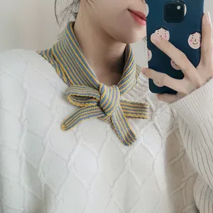 Knitted striped neckerchief detail shot showing blue and yellow pattern, versatile winter scarf.