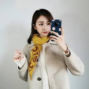Stylish knitted scarf for women, cozy winter fashion accessory with chic pattern design.