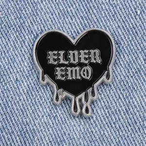 Gothic style heart enamel pin metal brooch badge detail closeup for stylish clothing accessory