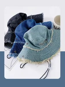 Distressed denim bucket hat for women men, trendy frayed edge sun hat with chin strap.