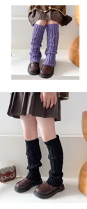 Detailed knit leg warmers showing cozy ribbed texture in stylish purple and black colors.