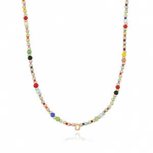 Bohemian colorful seed bead necklace with letter D pendant fashion jewelry detail shot.