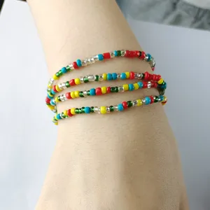 Detailed view of colorful seed bead multi-layer bracelet showing wrist wearing style detail