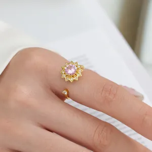 Goldener Anti-Angst-Ring mit rosa Kristallblume, verstellbarer offener Modeschmuck.