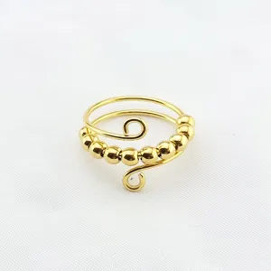 Goldener Titanstahl Spinner Ring mit beweglichen Perlen, Angstabbau und Entspannungsdetail.