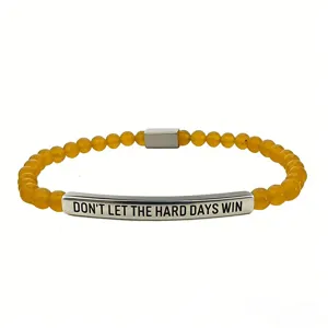 Bracciale ispiratore in acciaio inossidabile con barra incisa e perline gialle, gioiello trendy.