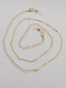 Detailed view of gold chain and clear crystal beads eyeglasses strap with silicone loops.