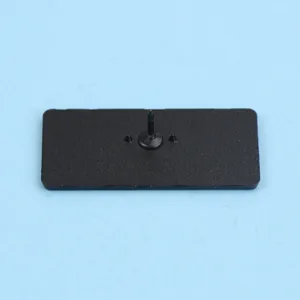 Detailed view of the black metal brooch pin back with secure locking mechanism and sharp pin.