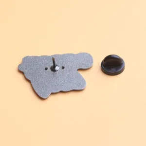 Close-up detail view showing the secure metal pin back and rubber clutch for brooch attachment.