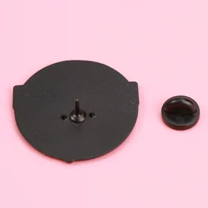 Close-up view of the black metal pin back and rubber clutch for custom brooch badges.