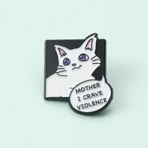 Close-up detail of a funny cat enamel pin with white cat design and funny text.