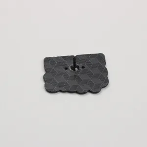 Detailed view of the black metal lapel pin back showing secure clutch and geometric texture.
