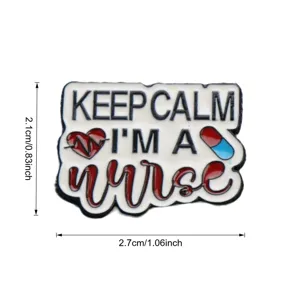 Detailed close-up shot of the nurse metal enamel brooch featuring creative quote and medical icons.