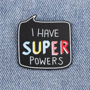 Black metal enamel pin with super powers letter design, fashion backpack badge accessory.