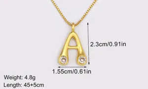 Close-up detail of 18k gold plated letter A pendant necklace with micro zirconia stones.