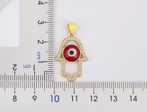 Gold plated hamsa hand evil eye pendant sparkling cubic zirconia detail charm accessory