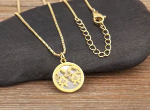 Gold plated twin girls pendant necklace with natural white shell and sparkling zircon.