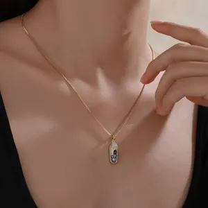 Elegant gold-plated rhinestone evil eye shoe pendant necklace for women fashion jewelry.