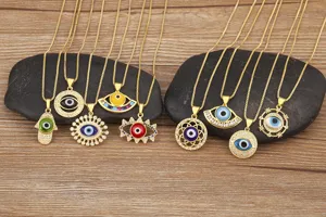 Detail shot of gold-plated evil eye necklace pendants with sparkling micro-inlaid cubic zirconia.