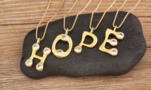 18k gold plated copper necklace featuring sparkling micro pave cubic zirconia letter pendants.