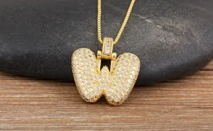 Gold letter W bubble pendant necklace with micro pave cubic zirconia for women detail view.