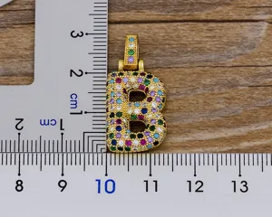 Detailed view of the gold-plated colorful cubic zirconia letter B pendant with size scale.