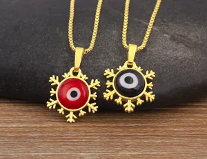 Collana malocchio placcata in oro con ciondolo fiocco di neve, elegante gioiello.
