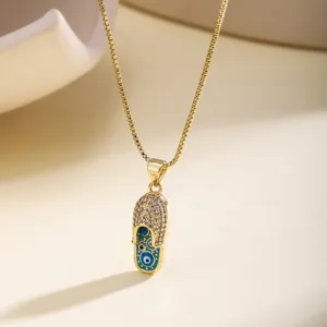 Gold-plated evil eye slipper pendant necklace with sparkling rhinestones for women jewelry.